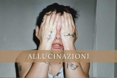 Madame con le mani tatuate a coprire il viso, foto promozionale del brano Allucinazioni dall'album Disincanto