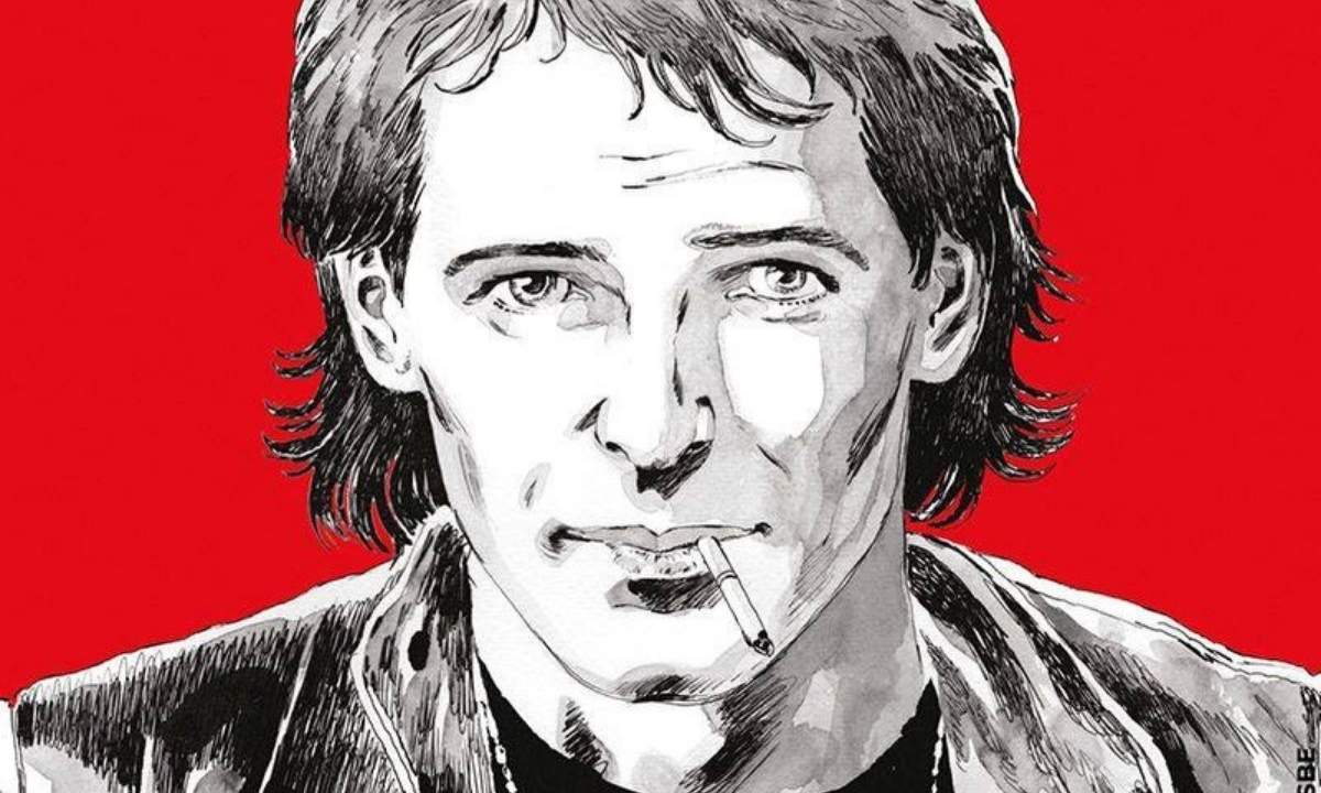 Illustrazione di Vasco Rossi giovane in bianco e nero su sfondo rosso, tratta dal fumetto "La rabbia giovane" di Sergio Bonelli Editore