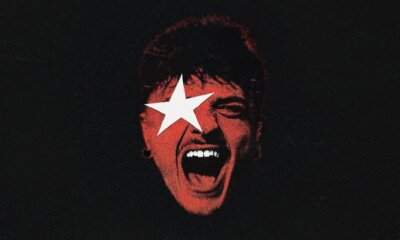 Artwork rosso di Tutta Vita - Live di Olly, volto urlante con stella bianca su fondo nero