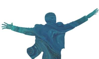 La silhouette a braccia aperte del logo di Domenico Modugno 100