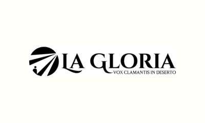 Logo dell'etichetta La Gloria con il motto Vox clamantis in deserto e i raggi di luce sulla figura di Giovanni Battista