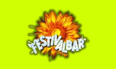 Il logo storico del Festivalbar, il fiore arancione su fondo verde acido