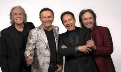 I Pooh in posa sorridenti, foto ufficiale della band