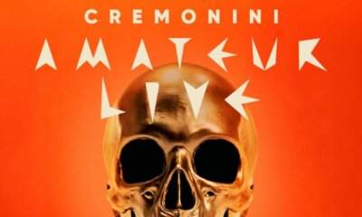 Locandina di Cremonini Amateur Live con teschio dorato su sfondo arancione, scritte bianche Cremonini Amateur Live