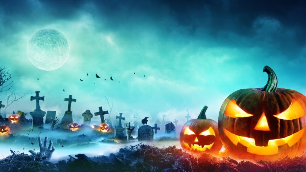 Concerti di Halloween 2026: zucche illuminate in un cimitero nella notte di luna piena