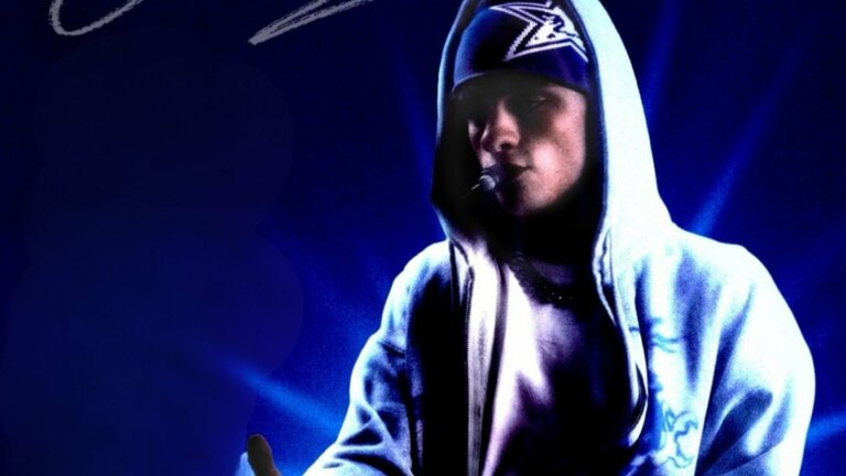 Luk3 con cappuccio e microfono headset su sfondo blu nella grafica del Live Tour 2027